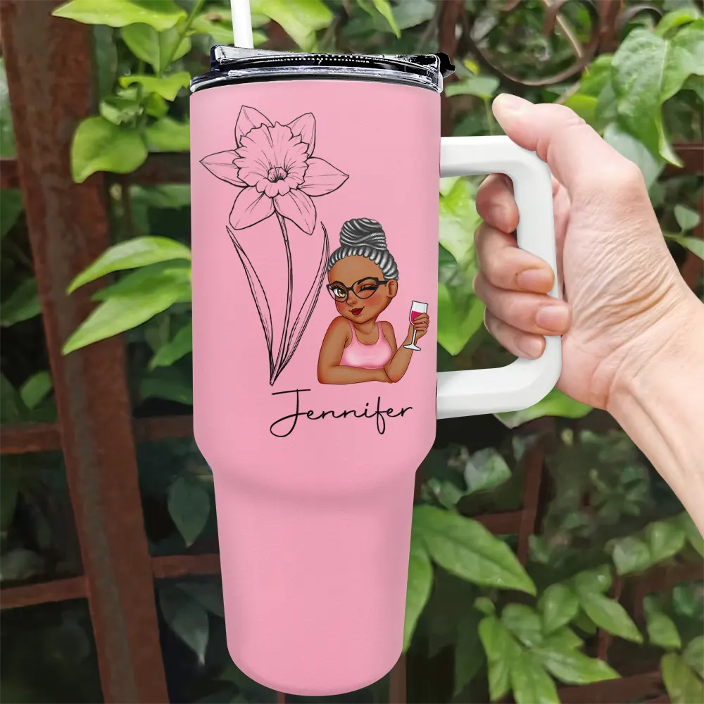 Personalized pink 40oz tumbler with a floral sketch and custom name, ideal for gifts.