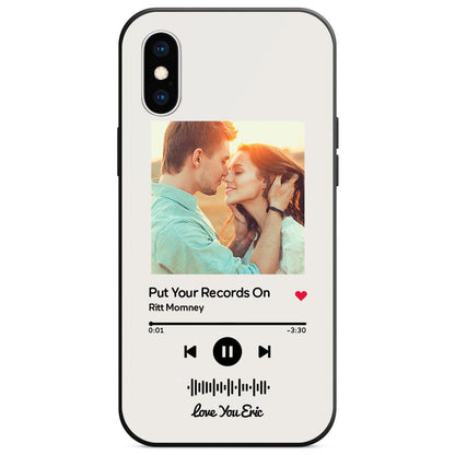 Personalized white glass iPhone case with couple photo and "Put Your Records On" music code.