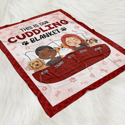 Personalized Couple Cuddling Blanket on white background with text 'This is our cuddling blanket' and cartoon couple and pet.