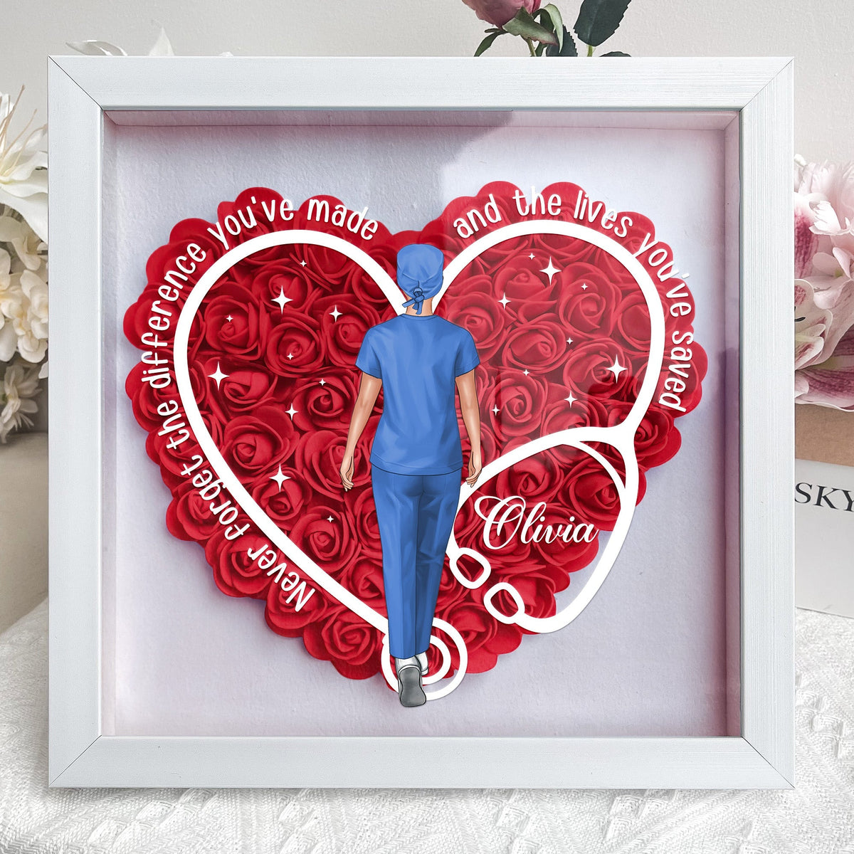 Personalized flower shadow box for nurses and doctors, heart-shaped with nurse figure and message.