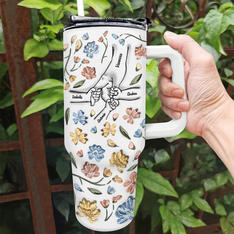 Personalized 40oz Tumbler with Hand In Hand design, floral pattern, and straw, a perfect gift for Mom and Grandma.